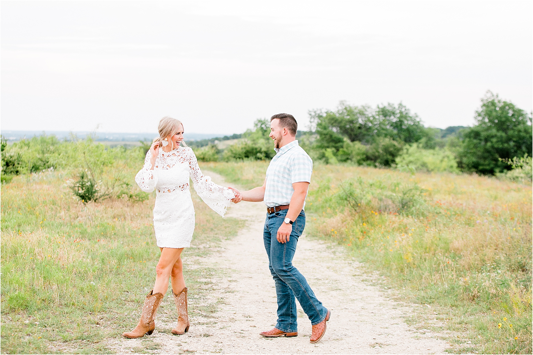 A bride to be pulls along her groom on the nature trails at Tandy Hills in Fort Worth, Texas 