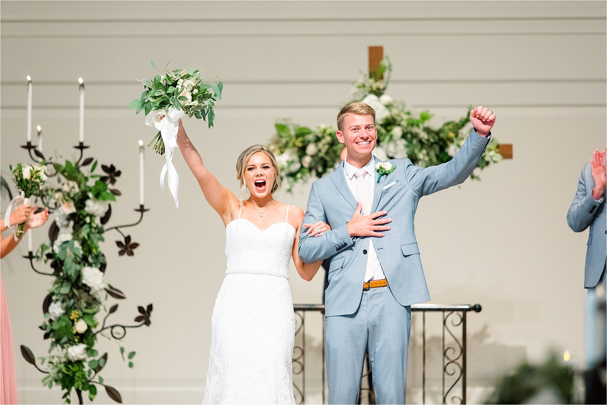 A Couple cheers after they are pronounced husband and wife at their Classic Dallas, TX Wedding by Jillian Hogan Photography 