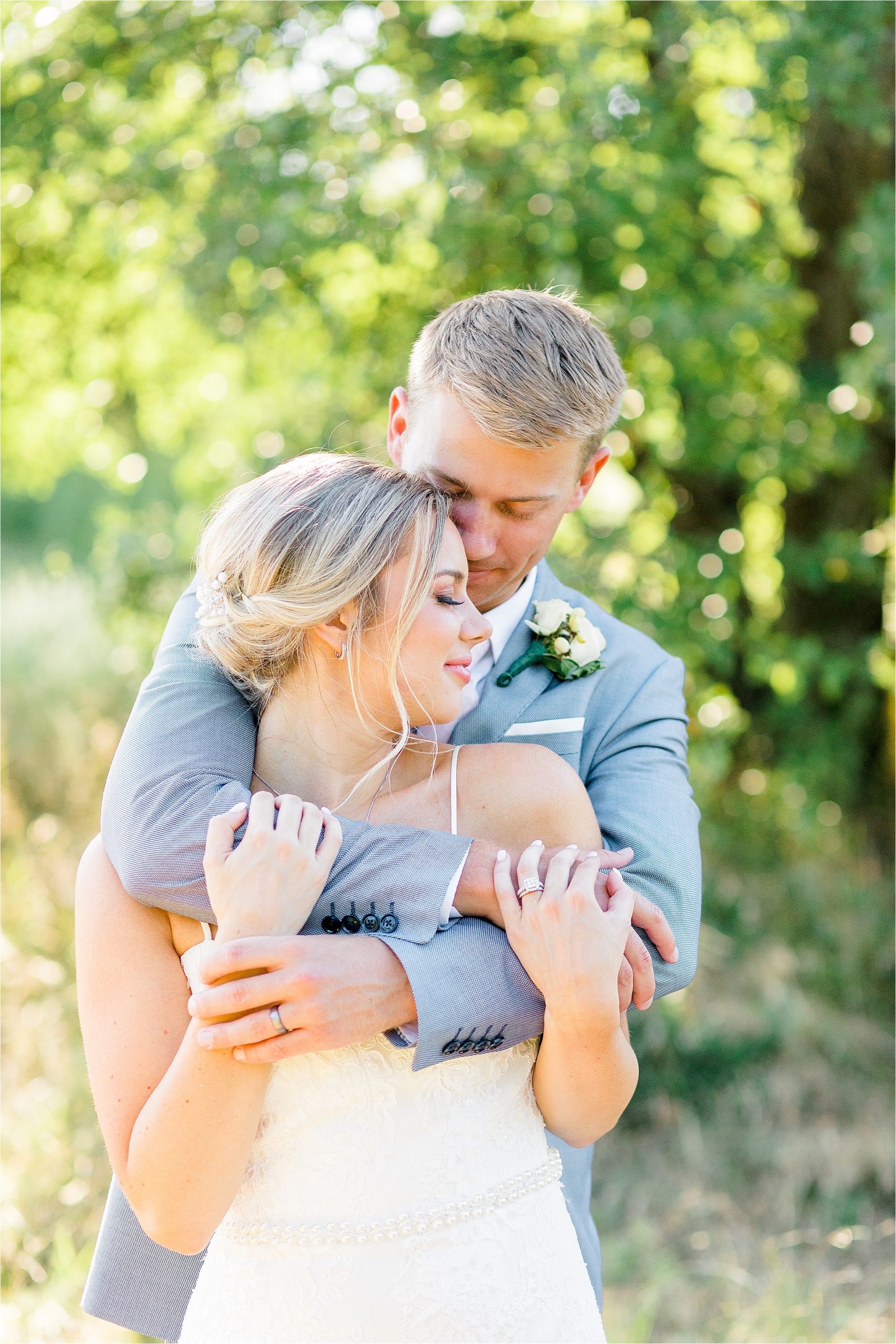 A couple embraces during wedding portraits at Arbor Hills by Dallas Wedding Photographer Jillian Hogan 