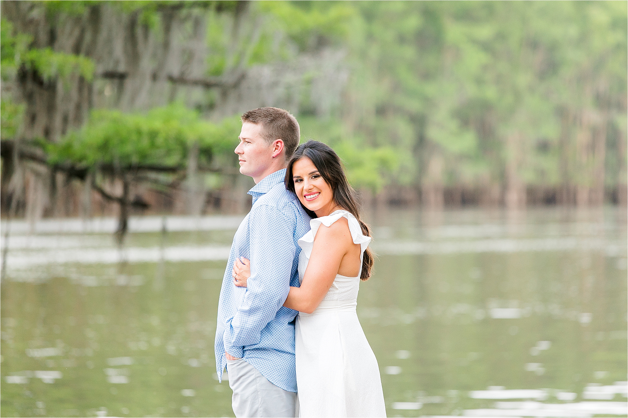 A couple hugging on the docks at Caddo Lake State Park during their East Texas Engagement Session 