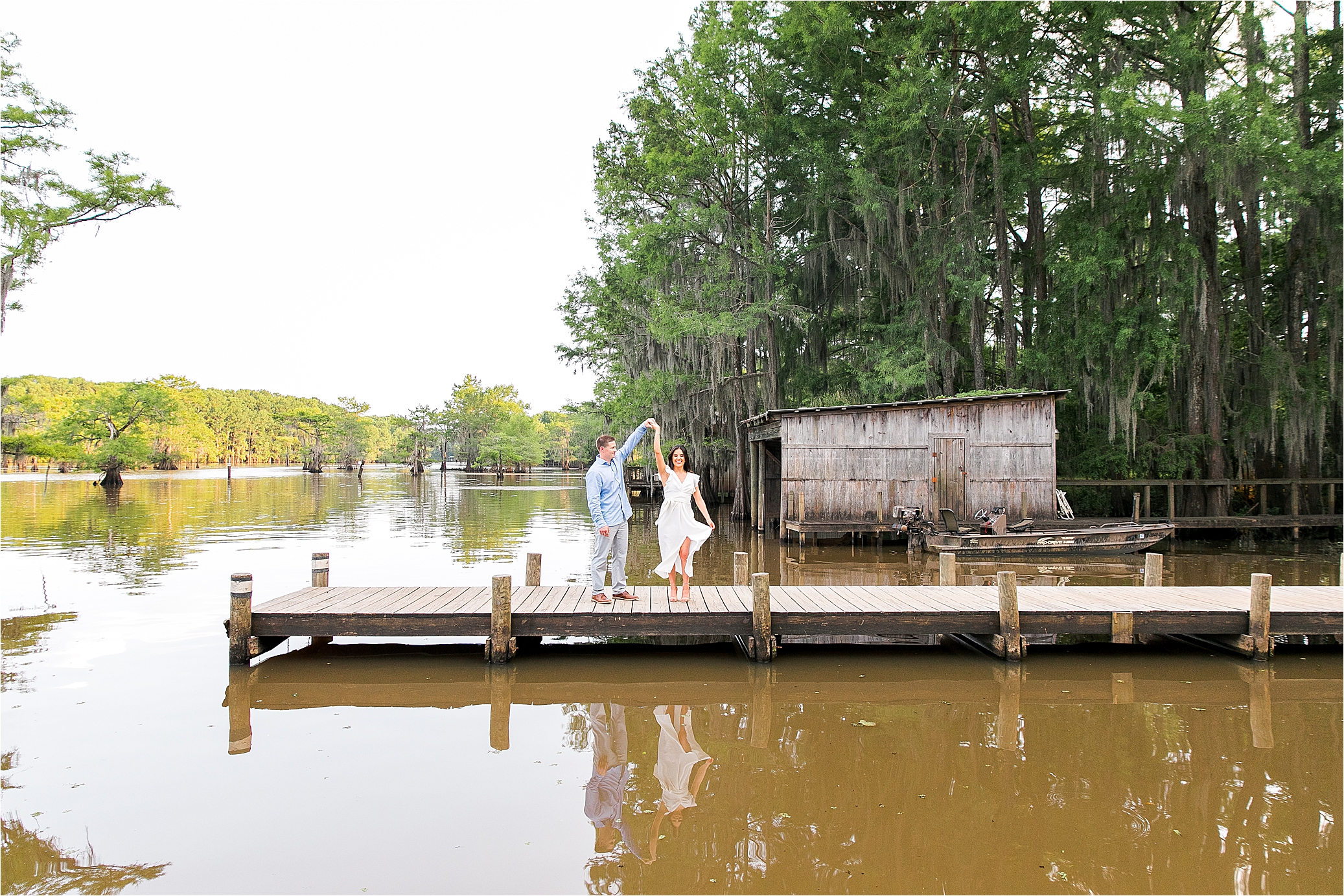 A Couple dancing on the docks at Caddo Lake State Park in East Texas during their engagement session 
