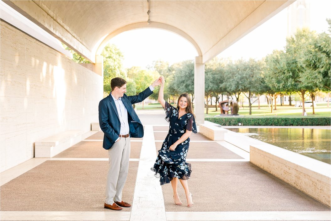 A bride to be twirls in her dress at The Kimball Art Museum during her Fort Worth Engagement Session with Jillian Hogan Photography 