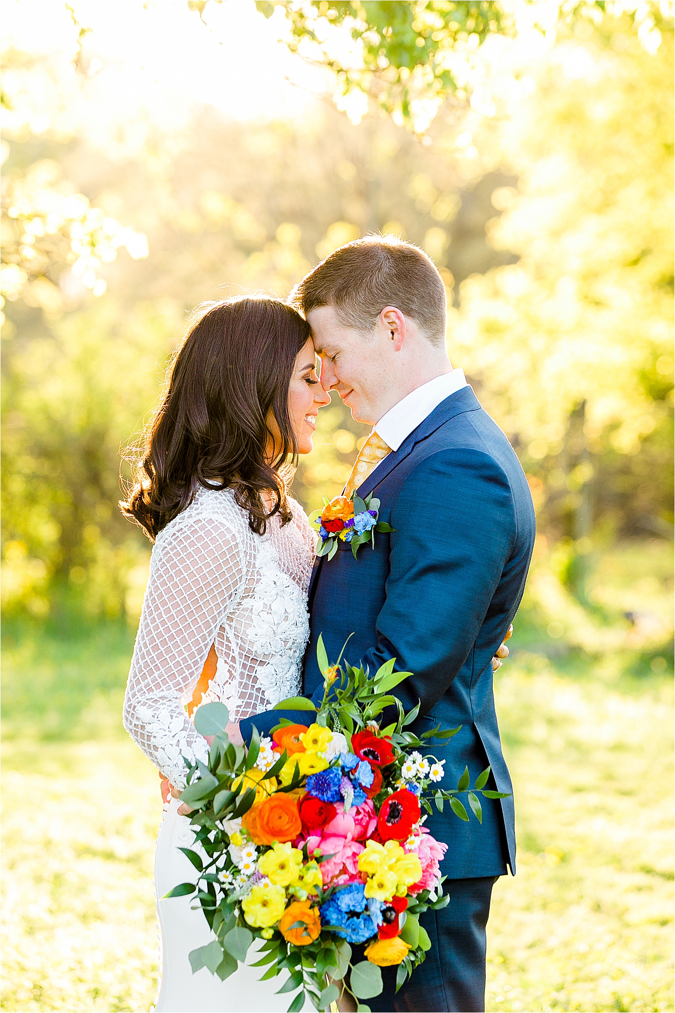A couple embraces with the golden light behind them during their wedding day portraits with Hill Country Wedding Photographer Jillian Hogan 