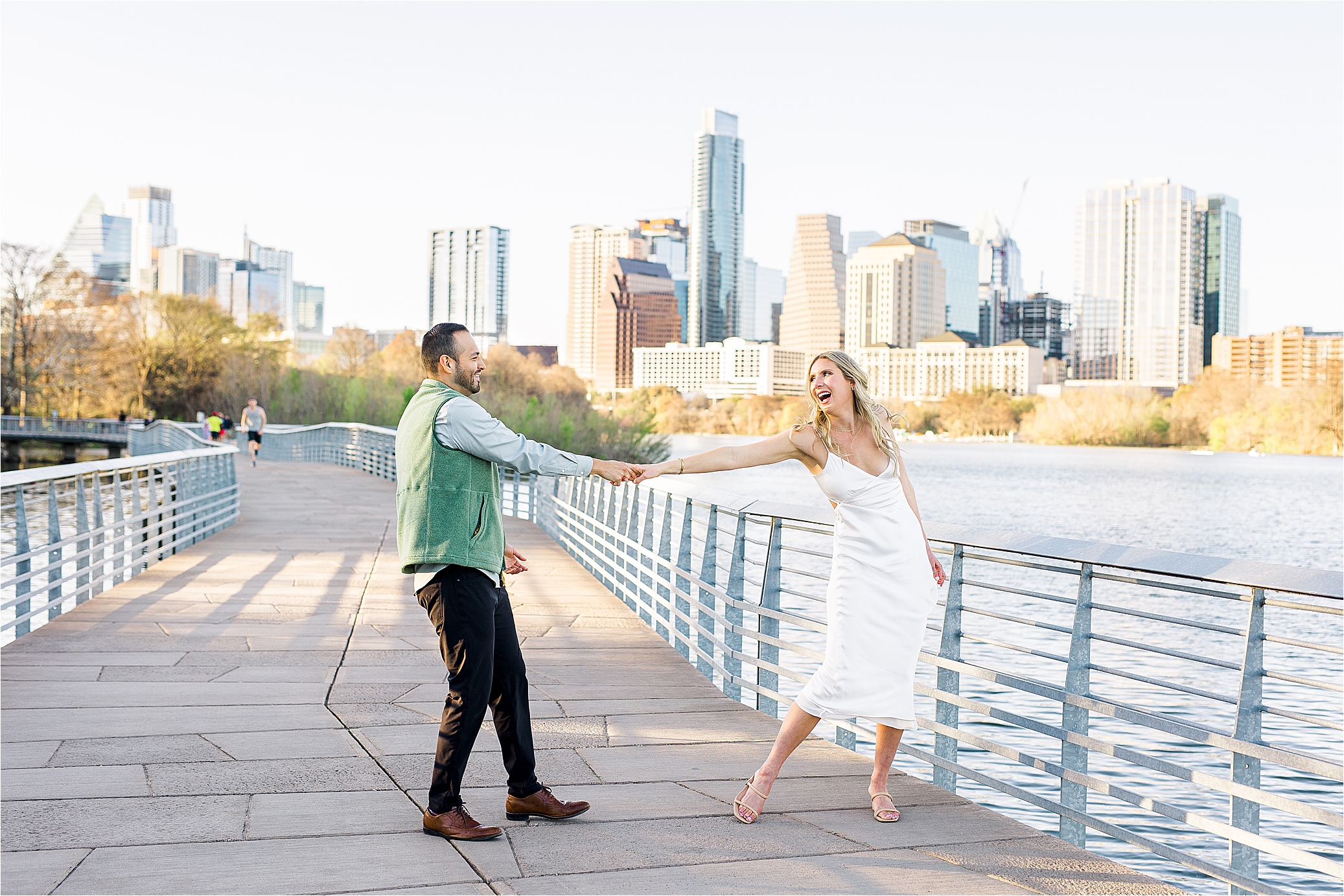A couple dances on the boardwalk in Austin for their Texas Engagement Session
