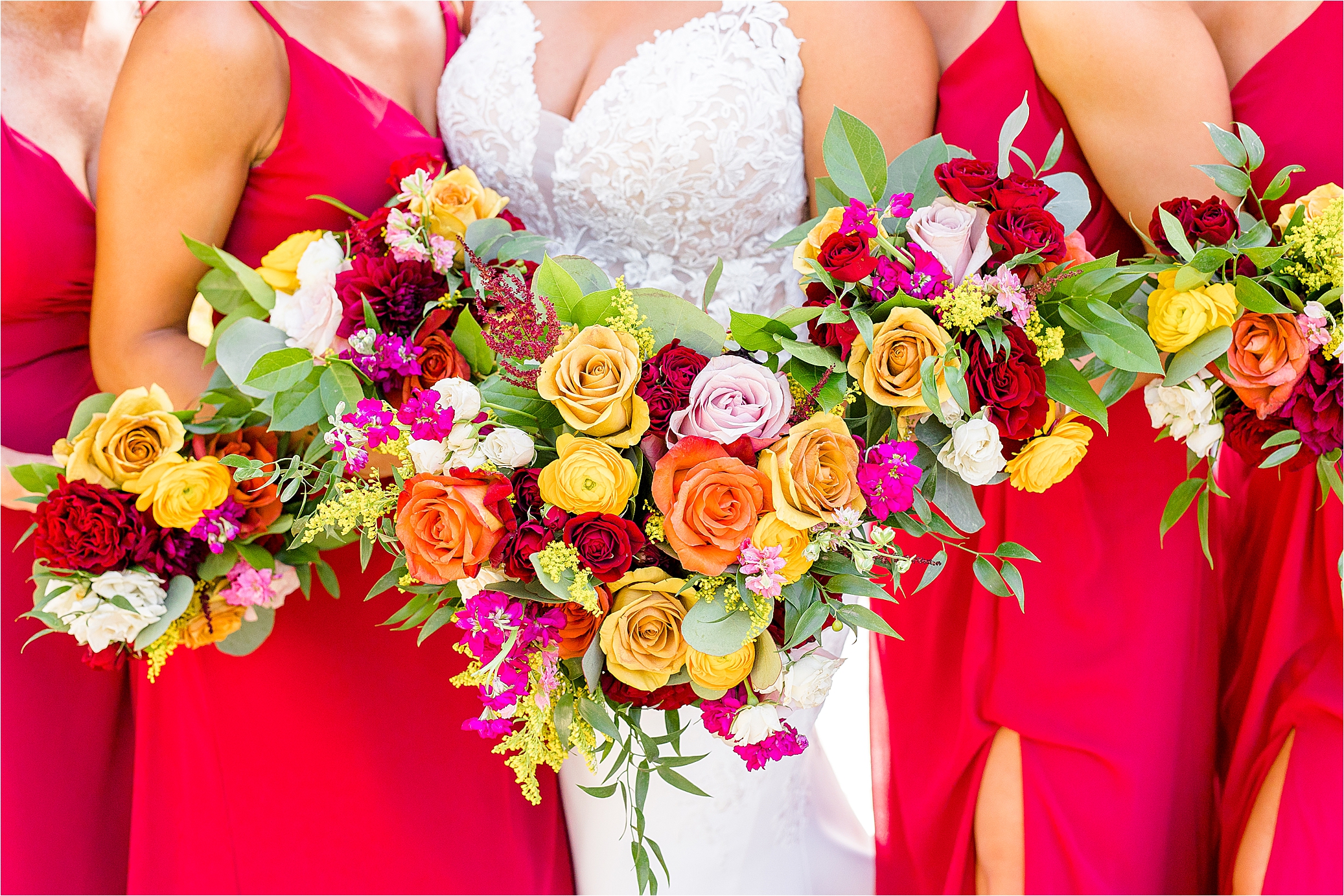 Yellow, Orange, Red and Pink flowers by Evember Floral for a wedding at Paniolo Ranch Wedding photographed by Jillian Hogan Photography 