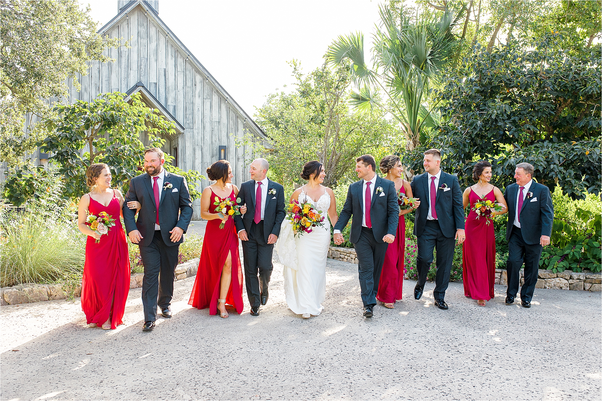 A bridal party walks toward the camera at Paniolo Ranch in Boerne, Texas