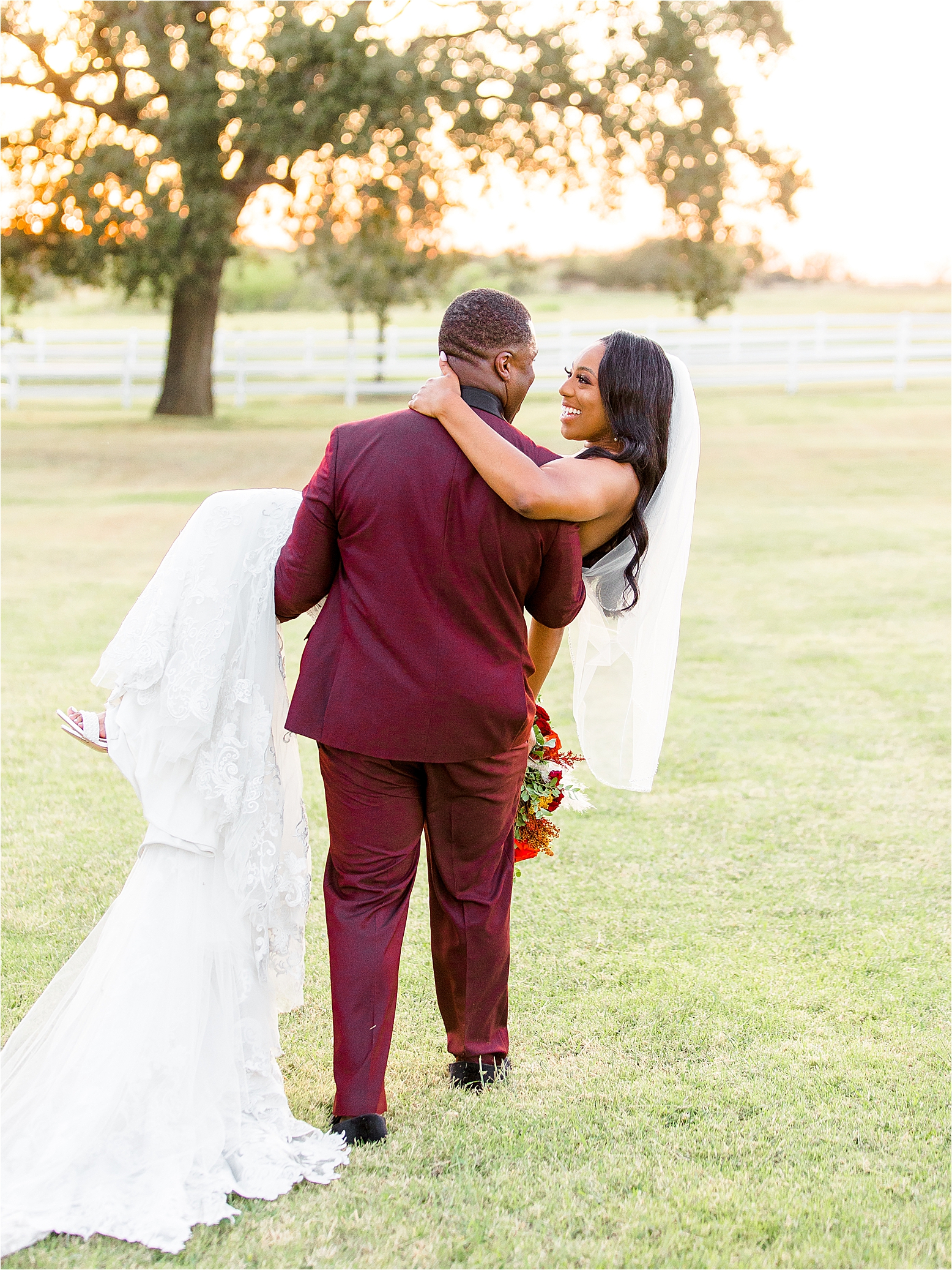 A groom carries his bride off into the sunset at The Milestone by Boerne Wedding Photographer Jillian Hogan 