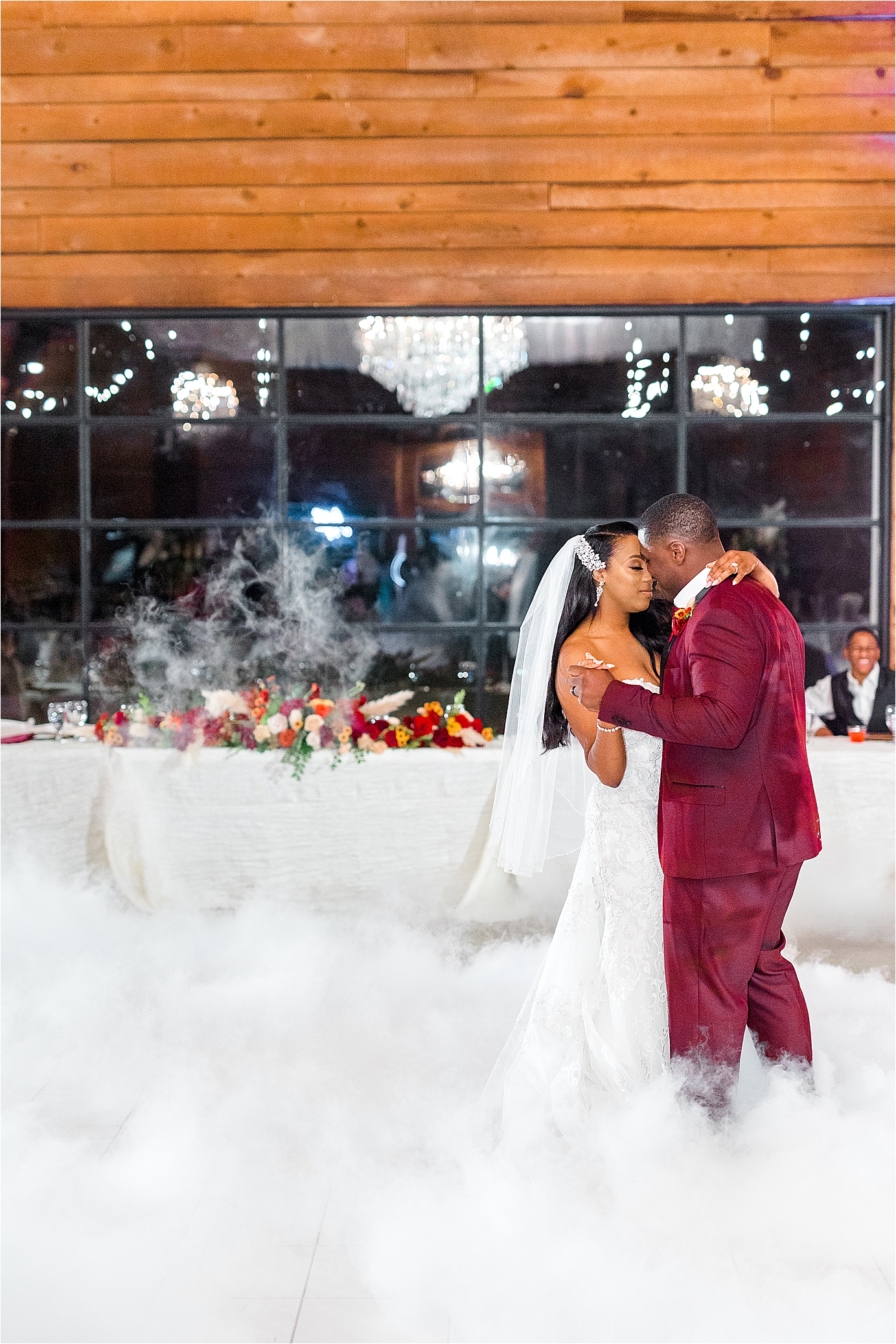 a newlywed couple shares first dance among cloud of smoke during wedding reception by Boerne Wedding Photographer Jillian Hogan 