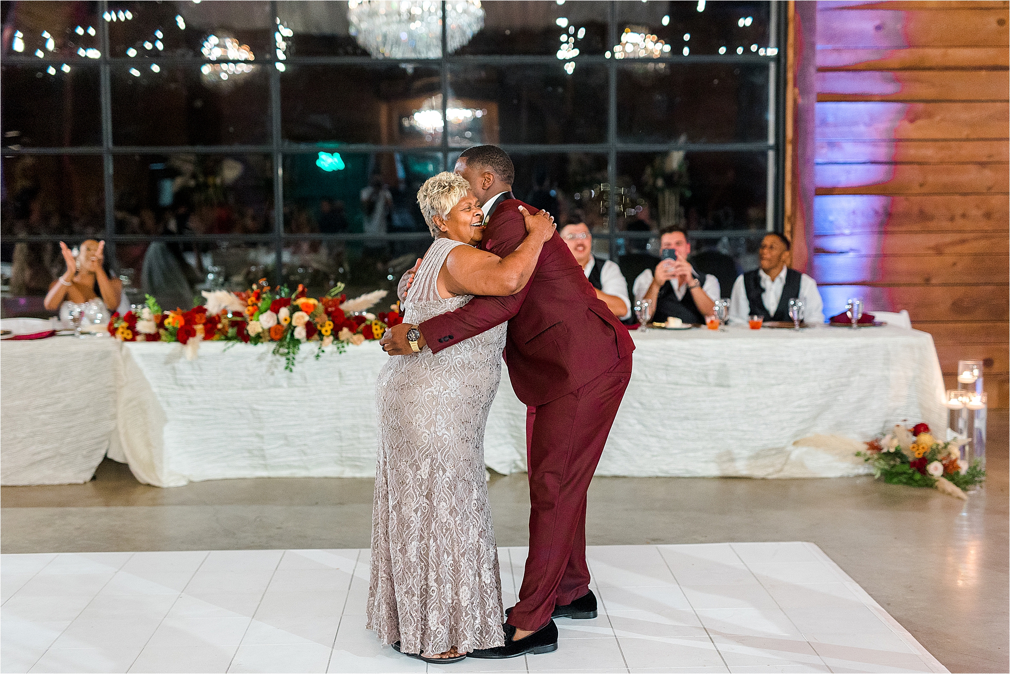 A groom hugs his mom as they dance during Morgan Creek Wedding Reception, Walter's Wedding Venue, by Boerne Photographer Jillian Hogan 