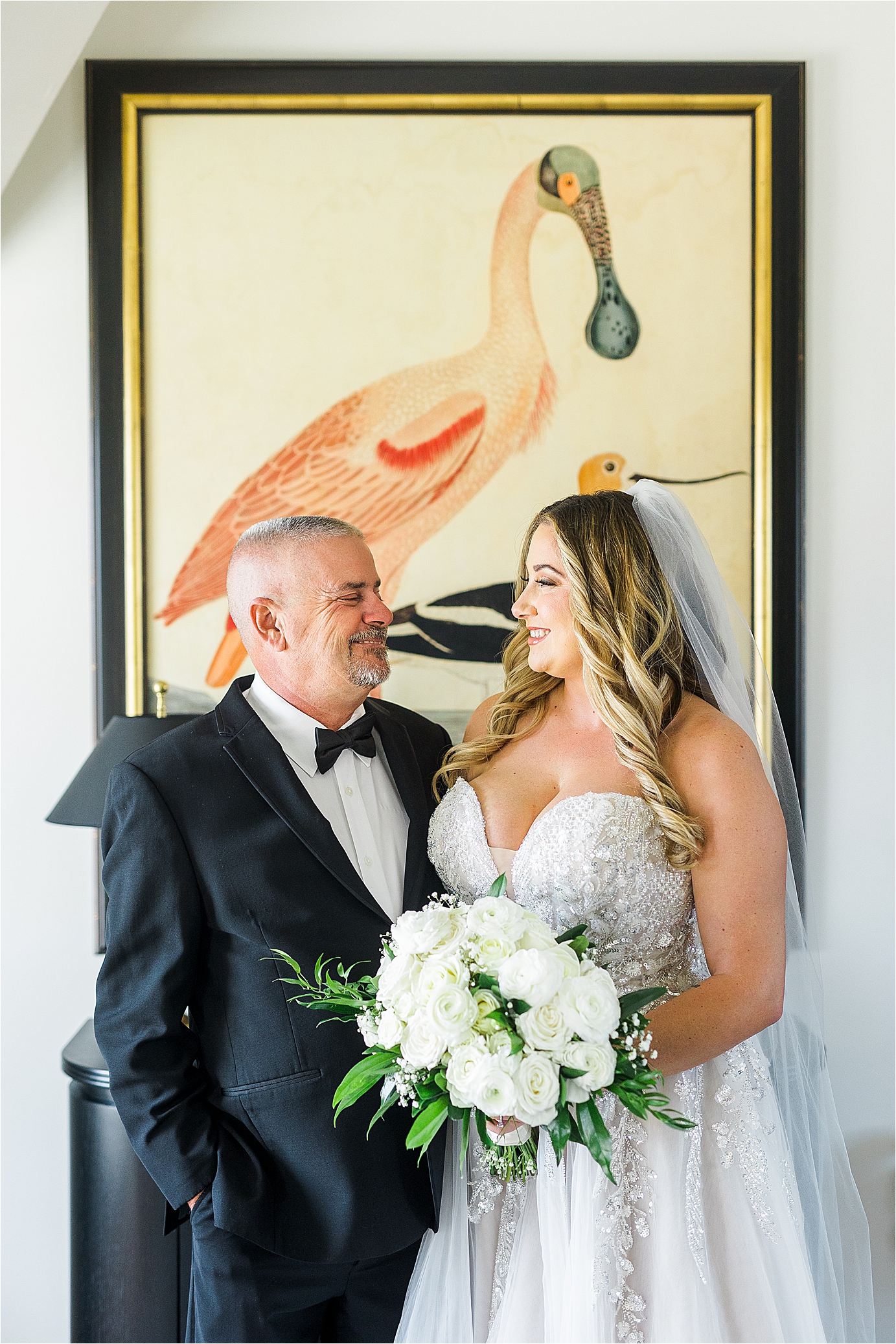 A father and daughter smile at each other on her wedding day at Redberry Estate in San Antonio, Texas