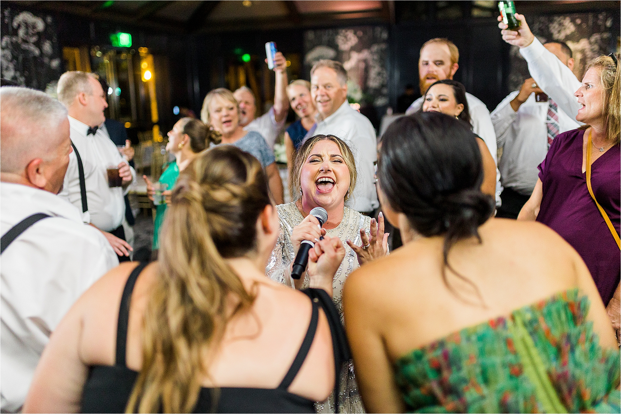 A bride singing during her wedding reception at The Redberry Estate in San Antonio, Texas 