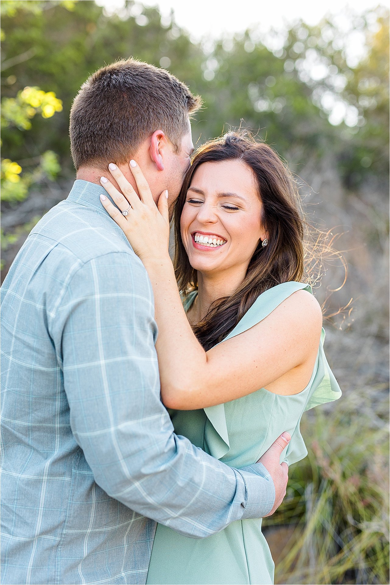 A fiance whispers something funny during their Pedernales State Park Engagement Session with Austin Wedding Photographer Jillian Hogan 